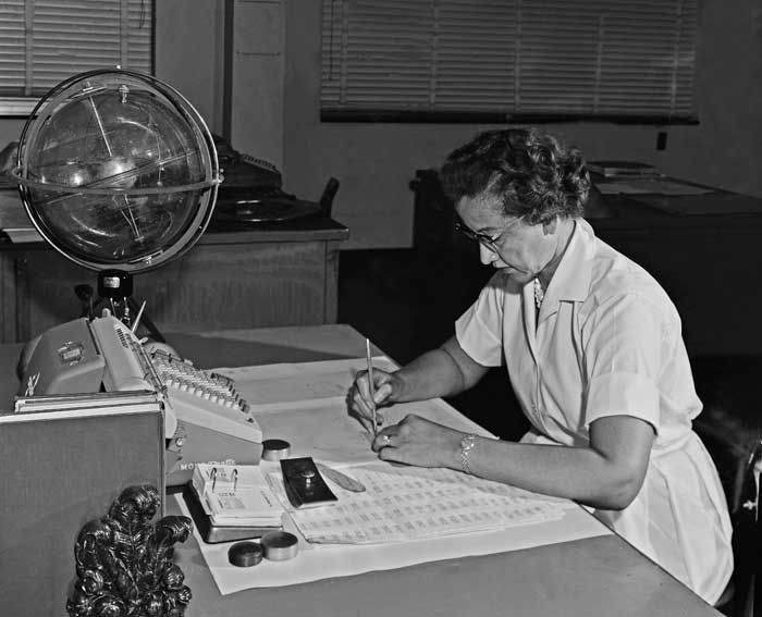 Photo of Katherine Johnson at work at NASA