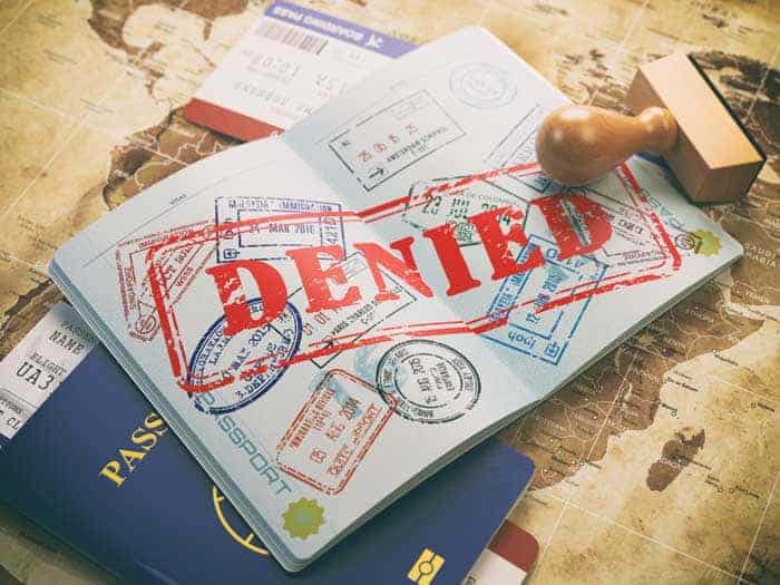 Photograph of a passport with a big stamping showing the holder has been denied entry